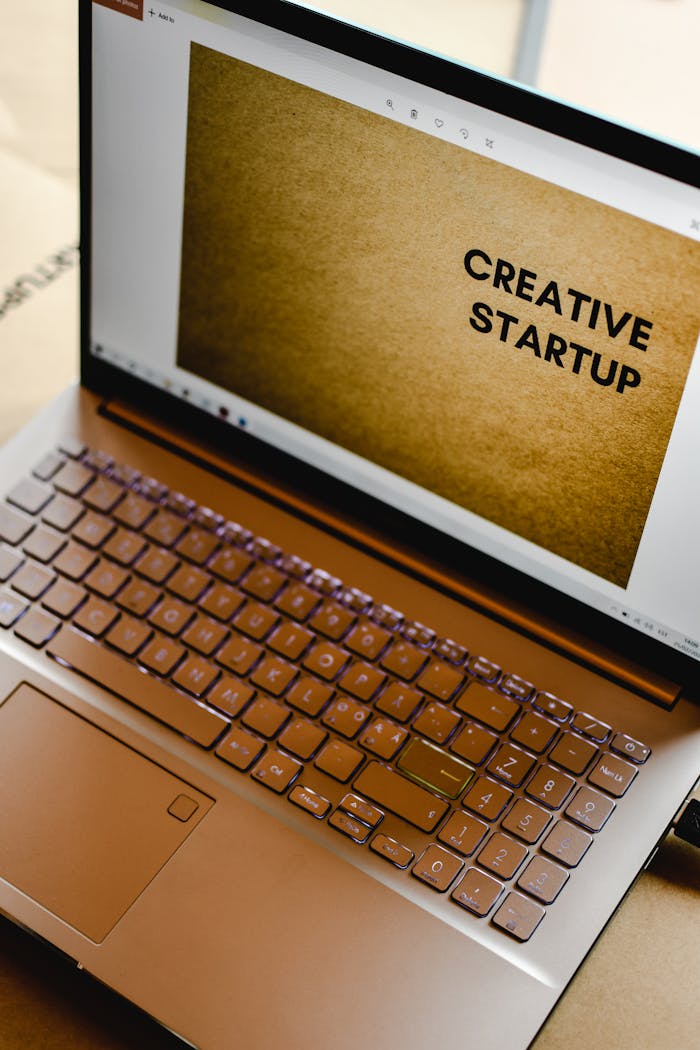 Laptop displaying Creative Startup concept in an inspiring workspace.